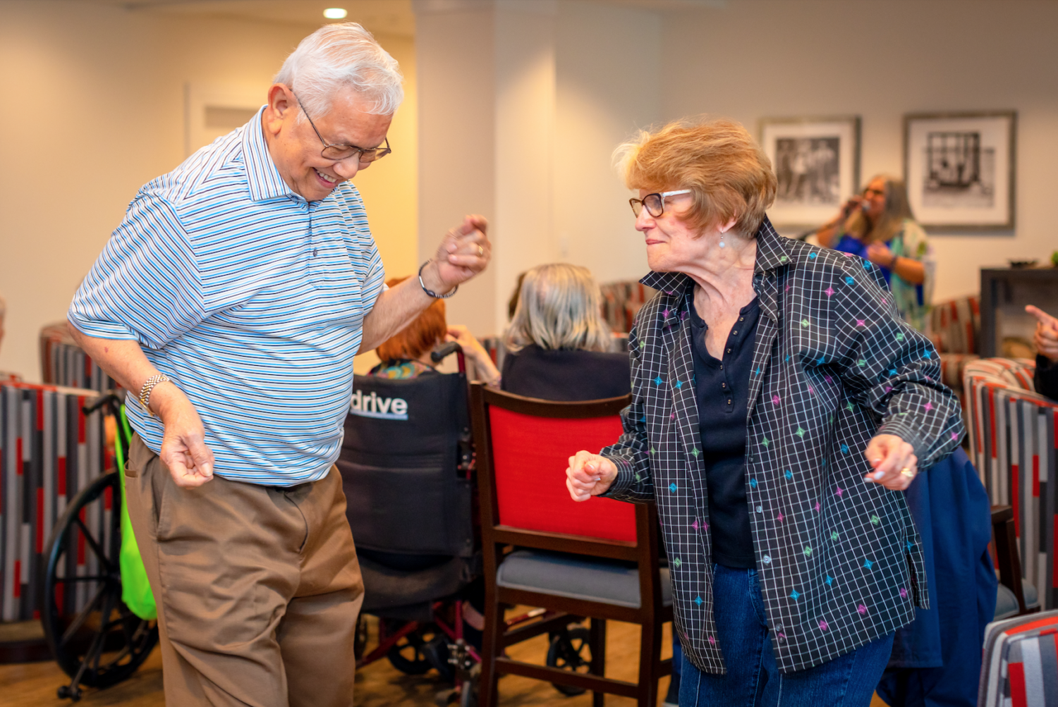 two senior residents dancing with one another at our retirement community