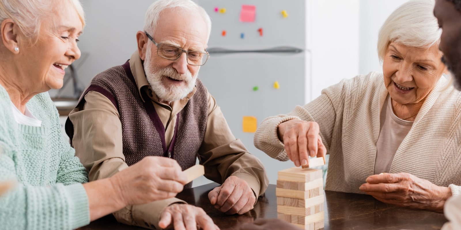 senior citizens playing Jenga