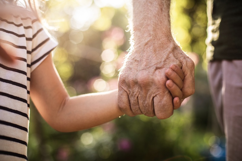 Senior Child Holding Hands