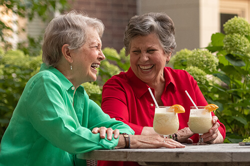 two of our residents enjoying a chilly drink on our outdoor patio